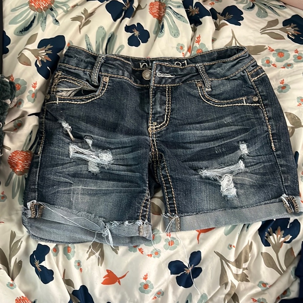Distressed blue jeans shorts